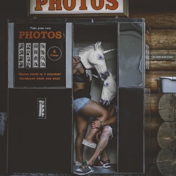 Two Persons With Unicorn Head Costumes in Photo Booth