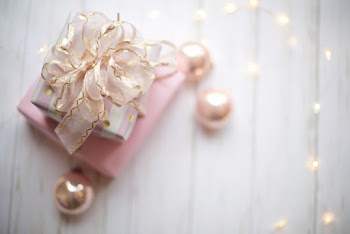 Two Pink and White Gift Boxes With Ribbon
