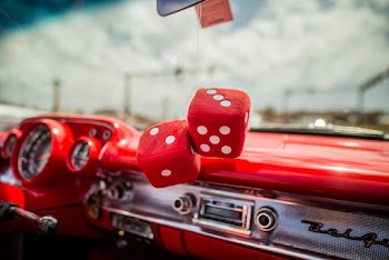 Two Red Dice Decor Hanging inside Red Car