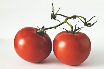 Two Red Tomatoes on White Surface