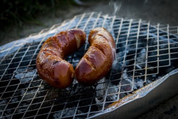 Two Sausages on Charcoal Grill