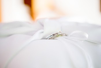 Two Silver-colored Rings on Wedding Cushion