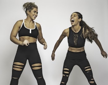 Two Smiling Women Wearing Sports Bra