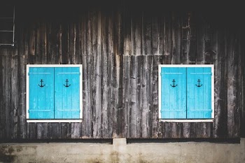two square blue wooden doors cabinet