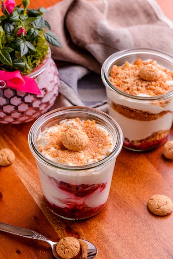 Two Strawberry Soft Served Filled Cups With Cookie Toppings