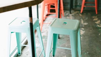 two teal plastic stools
