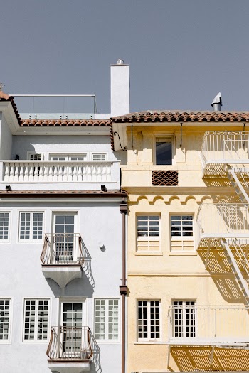 Two White and Yellow Concrete Buildings
