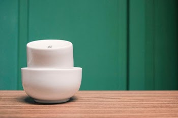two white bowls on table