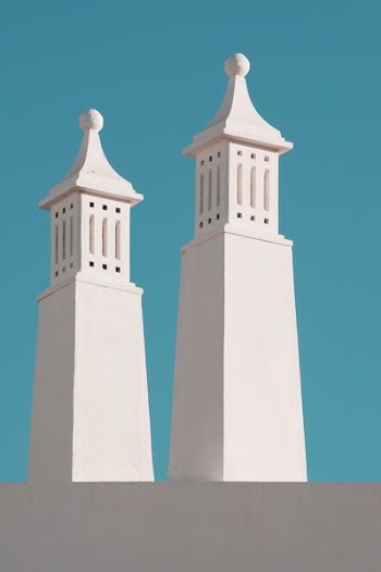 two white concrete pillars