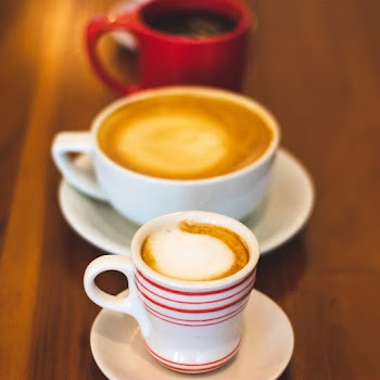 Two White Mugs Filled With Latte