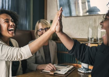Two Woman Doing High Five