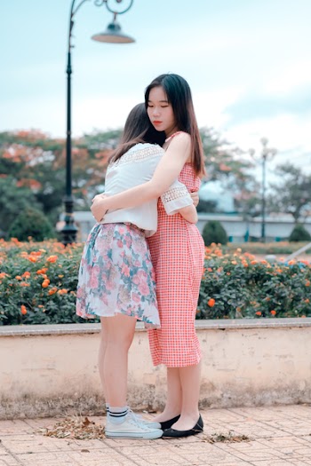 Two Woman Hugging Eachother
