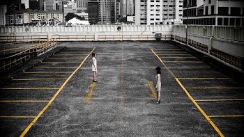 two woman in parking lot