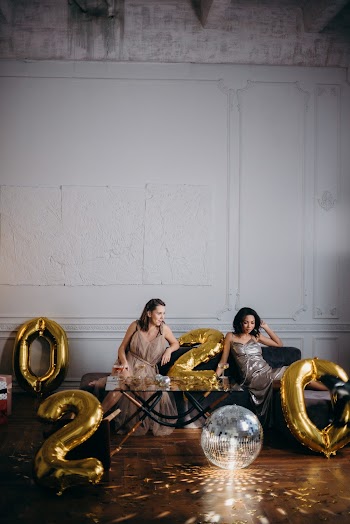 Two Woman Sitting on Sofa