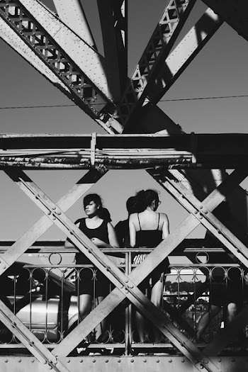 Two Woman Standing on Suspension in Grayscale Photography