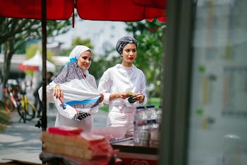 Two Women Buying Street Food