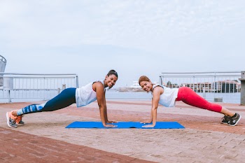 Two Women Doing Push-ups