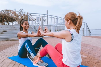 Two Women Doing Yoga Together