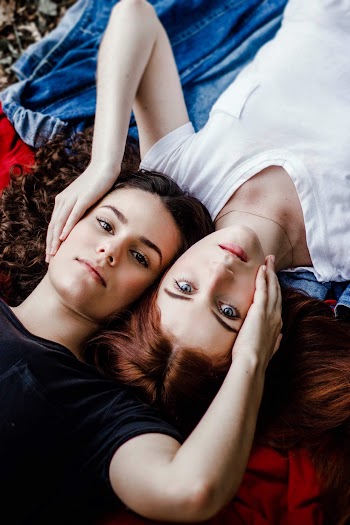 Two Women Holding Each Other's Face 