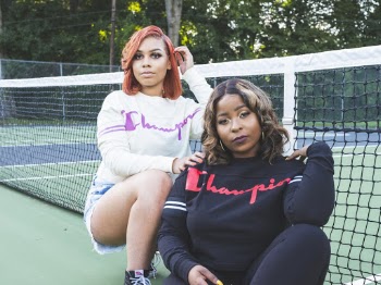 Two Women In A Tennis Court