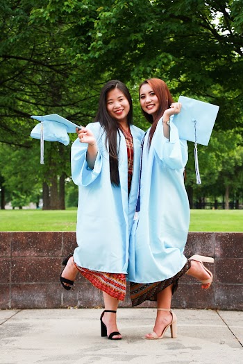 Two Women in Blue Academic Regalia