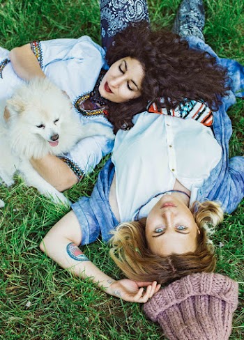 Two Women Lying on Green Grass
