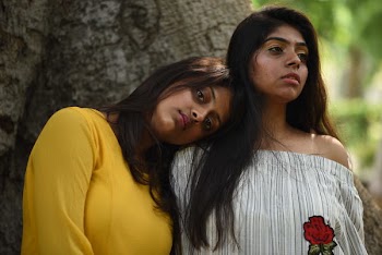 Two Women Resting Under Tree