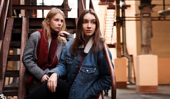 Two Women Sitting on Stairs