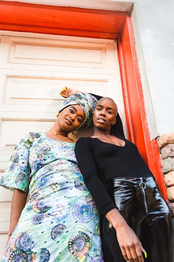 Two Women Standing Beside Each Other