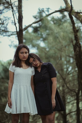 Two Women Standing Beside Each Other