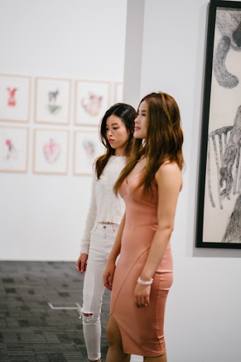 Two Women Standing Inside Museum