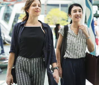 Two Women Standing Near Road