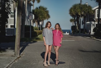 Two Women Standing on Empty Road