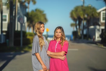 Two Women Standing on Road