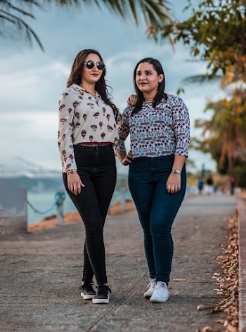 Two Women Standing on Street