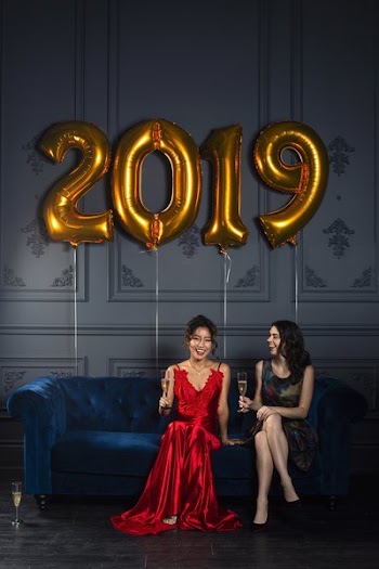 Two Women Toast To 2019 With Champagne
