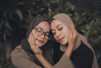 Two Women Touching Each Other's Faces