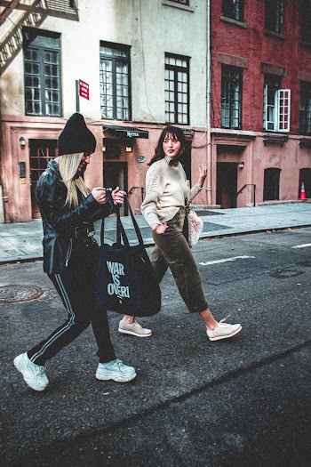 Two Women Walking and Chatting 