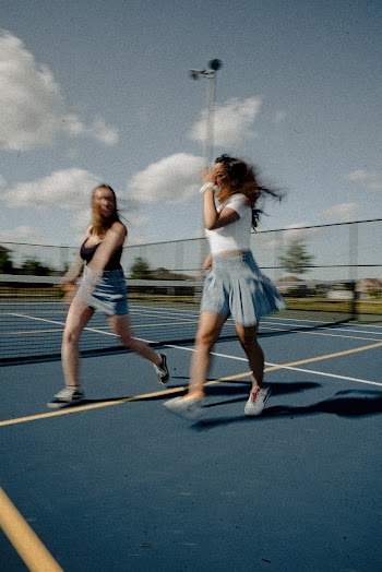 Two Women Walking Near Each Other