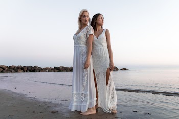 Two Women Wearing White Lace Dress At The Beach