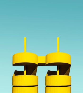 two yellow pilar towers close-up photography