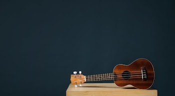 Ukulele On Blue Background