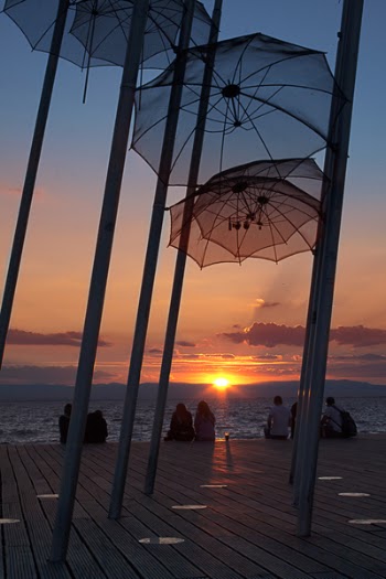 Umbrellas Hanged on Poles Near Dock