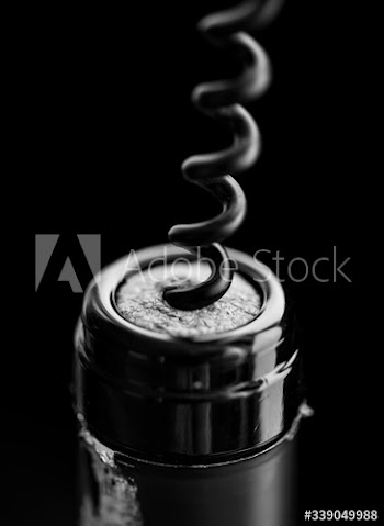 Uncorking a bottle of red wine