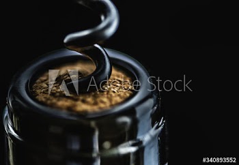 Uncorking a bottle of red wine