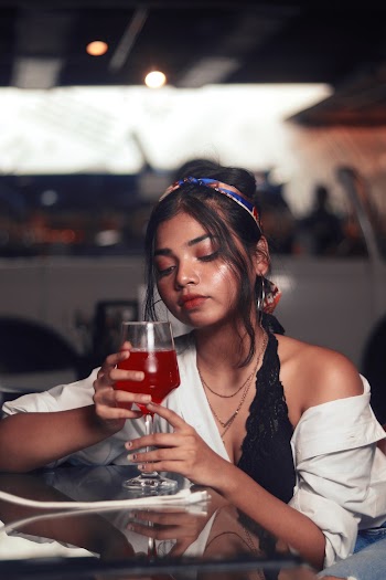 Unknown Celebrity Holding Clear Footed Glass