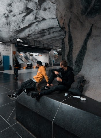 Unknown Men Sitting Indoors