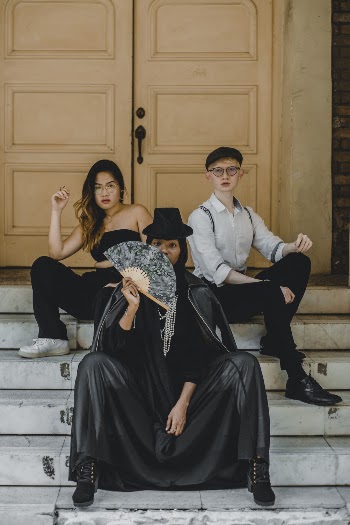 Unknown People Sitting on Concrete Steps