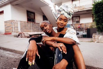 Unknown People Sitting Outdoors