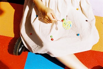 Unknown Person Holding Lollipop